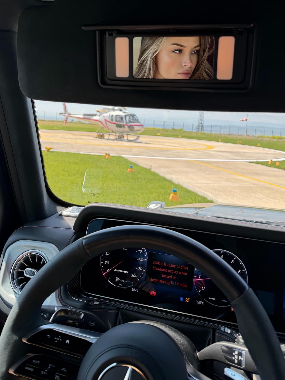 G-Class interior, the driver reflected in the mirror