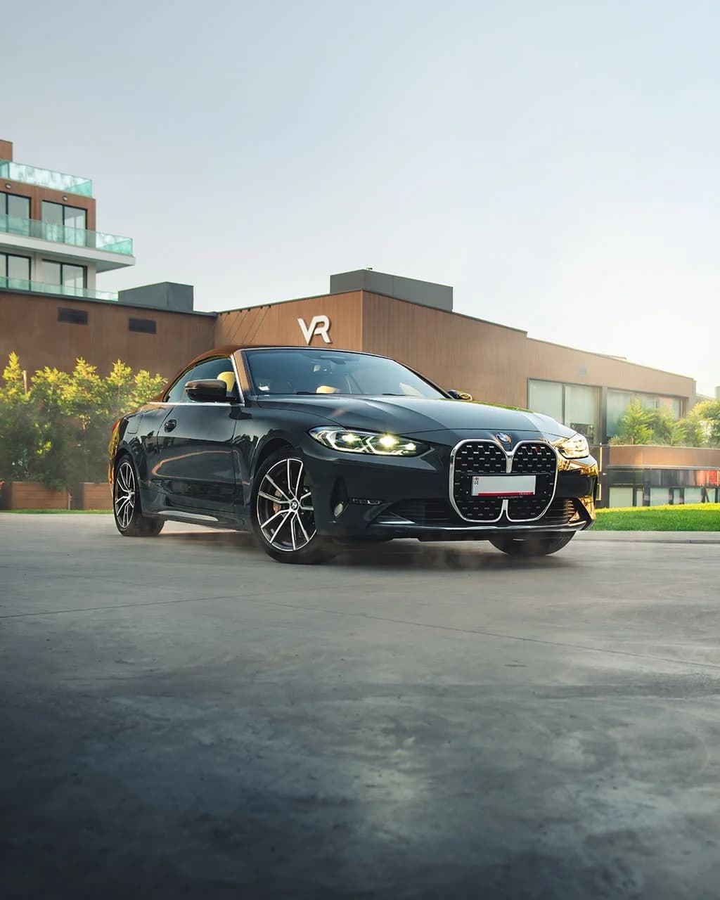 Black BMW 430i Convertible, roof up, front three-quarter
