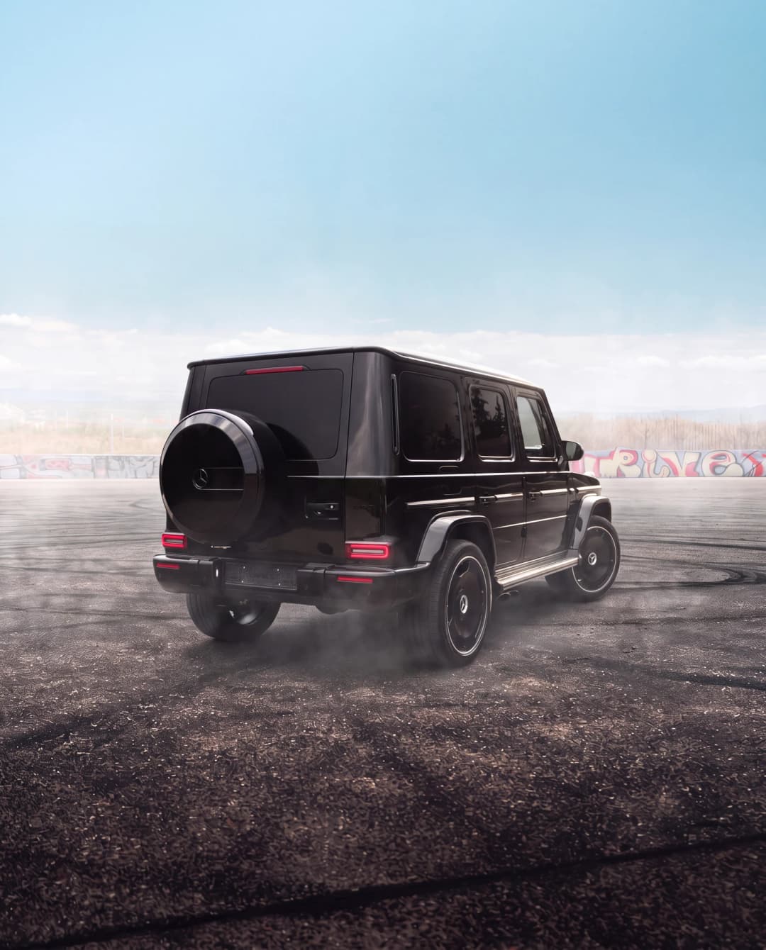 Black G63 2025 rear three-quarter with spare wheel